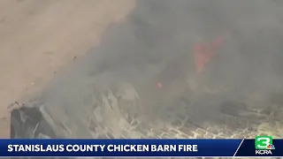 Crews are battling a chicken barn and vegetation fire near 28 Mile Road in Stanislaus County