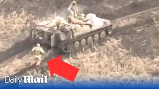 Russian soldier abandoned by fleeing comrades on armoured vehicle leaving him stranded in Donetsk