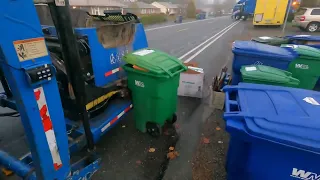 Republic service curotto can garbage truck working in fog