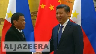 Philippines’ Duterte warms China ties with Beijing visit