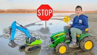 Learning road rules and mud challenge tractor video collection. Darius learns traffic signs