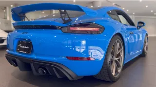 4K Porsche 718 Cayman GT4 in Shark Blue w/ Black Race-Tex interior and Speed Blue Stitching.