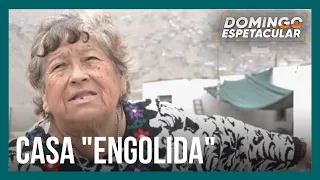 Casa é "engolida" por presídio em Lima, no Peru