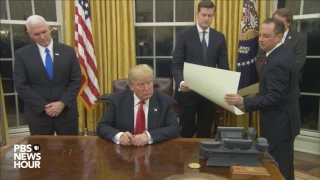 Watch President Trump's first signings in Oval Office