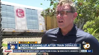 Crews work to clean up mess after train derailment