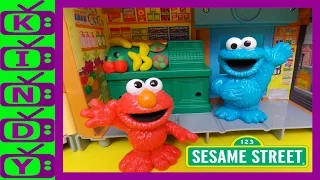 Sesame Street. Elmo and Cookie Monster toys, using play-doh with the Sesame Street playset.