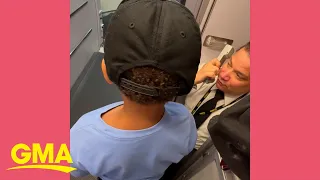 Pilot makes 2 boys honorary crew members for their flight