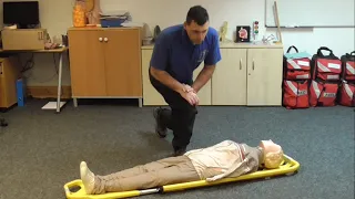 Loading a patient onto a scoop stretcher
