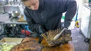 Huge Blocks of Meat and Ribs on Circular Grill. Kiev Street Food