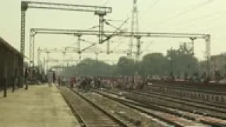 Indian farmers stage sit in on railroad tracks