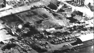 Aerial views of damage from U.S. Army 155 mm Long Tom guns firing upon Mortain, F...HD Stock Footage