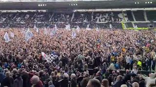 Derby fans with their chant towards rivals Forest after promotion yesterday