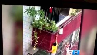 Child in China Hangs by Head thru Railing from 4th floor Man Holds Boy Up by Feet