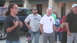 Greg Kelley speaks outside Burnet police headquarters