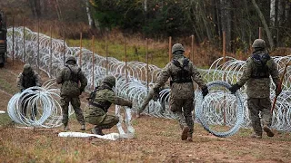 Poland builds razor wire fence along Russian border to stop possible migrant surge