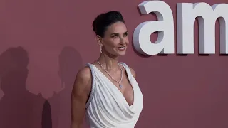 Cher, Demi Moore attend the amfAR gala in Cannes