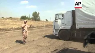 Large Russian aid convoy heads toward Ukraine, parks near border