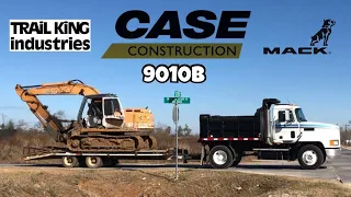 Loading and moving a case 9010b excavator with a trail king pintle hitch trailer