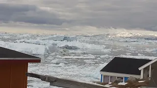 iceberg water cloudy sky Ilulissat