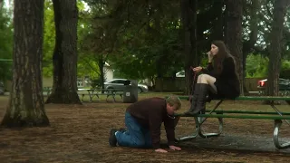 Study of a woman resting in a park with her pet