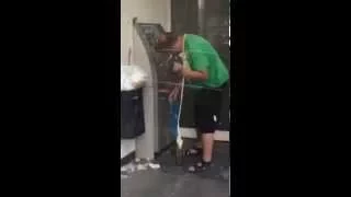 Drunk guy using an ATM ... And then something incredible happens