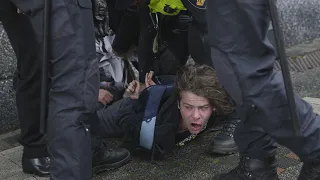 VIDEO | Protester detained as Macron visits Amsterdam University