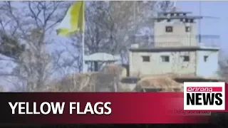 Koreas hoist yellow flags at DMZ guard posts to show they are being dismantled