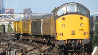 Class 37 and DBSO test train passing Clapham Junction