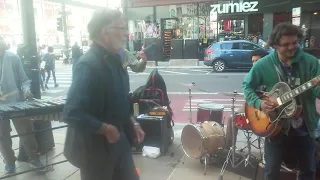 While my guitar gently weeps by street performers