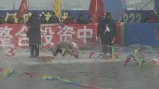 Swimmers brave icy waters for start of Harbin's Ice Festival