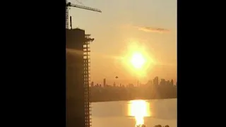 Basejumper launches off Toronto construction crane