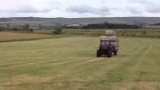 Case 1494 leading bales