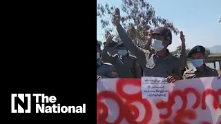 Myanmar police officers join anti-coup protesters