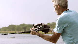 This Fisherman Nearly Loses His Prize Catch to a Hungry Crocodile