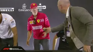 Vettel gets gifted Rubik's cube after press conference