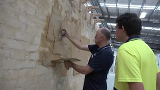 Plastering- lecturer Keith rendering a wall