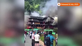Fire engulfs village building in southern China