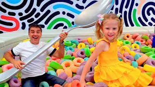 Nastya and dad have fun in the playgrounds and the amusement park for kids