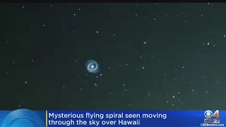 Mysterious flying spiral seen moving through the sky over Hawaii