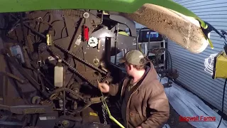 Working on the hay baler