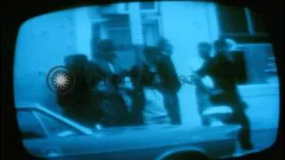 Television screen shows police patrolling the streets after the riots in Washingt...HD Stock Footage