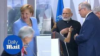 Merkel and Modi arrive for climate session but Trump doesn't turn up