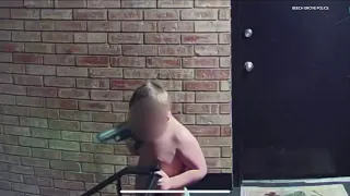 Shocking video shows toddler carrying loaded gun outside Indiana apartment