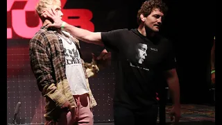 Ben Askren puts his hand in Jake Paul's face at the stare down