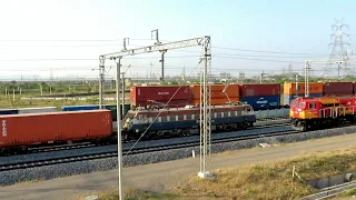 Heavy rail traffic on track , 3 Double Stack Container Trains crossing