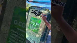 graffiti tag on bus stop glass