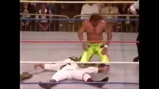 SNME #6:  Jake "The Snake" Roberts DDTs Ricky "The Dragon" Steamboat on the concrete.