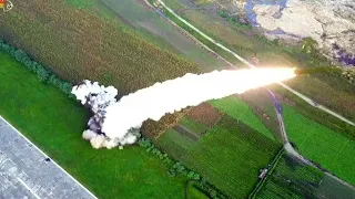 N.Korea releases photos of 'super-large' rocket launcher tests | AFP