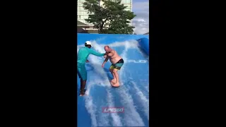 Guy falls miserably during surf simulator