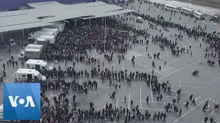 Drone Footage Shows People Queuing for Aid in Mariupol